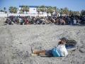 Varios inmigrantes en una playa, a 21 de agosto de 2026, en Ceuta (España).
