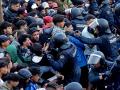 Traslado de inmigrantes asentados en la playa de Benítez, este viernes