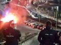 Agentes de la Policía Nacional observan un contenedor ardiendo en Ceuta