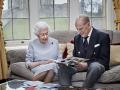 In this image released on Thursday Nov. 19, 2020, Britain's Queen Elizabeth II and Prince Philip, Duke of Edinburgh look at a homemade wedding anniversary card,England, Nov. 17, 2020,