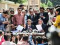 Public prosecutors A R Patel (C-L) and Sudhir Brahmbhatt (C-R) speak to the media outside the Sessions Court in Ahmedabad on February 18, 2022, after an Indian court sentenced 38 people to death over a string of bomb blasts in 2008 that killed dozens in the city of Ahmedabad. (Photo by SAM PANTHAKY / AFP)