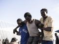 Inmigrantes tras el asalto masivo a la valla de Melilla la pasada semana