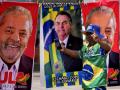 A demonstrator dressed in the colors of the Brazilian flag performs in front of a street vendor's towels for sale featuring Brazilian presidential candidates, current President Jair Bolsonaro, center, and former President Luiz Inacio Lula da Silva in Brasilia, Brazil, Tuesday, Sept. 27, 2022. Brazilians head to polls on Oct. 2 to elect a president, vice president, governors and senators. (AP Photo/Eraldo Peres)