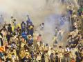 Prodemocracy protesters in Hong Kong flee amid tear gas fired by riot police in the evening of Sept. 28, 2014.