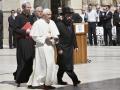 Pope Benedict XVI, centre,  is escorted by the Rabbi of the Western Wall Shmuel Rabinovitch, centre right, during his visit to the Western Wall, Judaism's holiest site, in Jerusalem's Old City, Tuesday, May 12, 2009. The Pope is on a five-day visit to Israel and the Palestinian Territories.