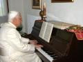 In this photo released Monday July 17, 2006 by the Vatican newspaper L'Osservatore Romano, Pope Benedict XVI plays a piano in Les Combes d'Introd, in the Aosta Valley region, northern Italy, Friday, July 14, 2006.