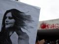 Photograph of a banner showing a picture of young Kurdish woman Mahsa Amini, during a demonstration
