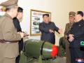 This picture taken on March 27, 2023 and released by North Korea's official Korean Central News Agency (KCNA) on March 28, 2023 shows North Korean leader Kim Jong Un (C) inspecting a nuclear weaponisation project at an unknown location in North Korea. (Photo by KCNA VIA KNS / AFP) / South Korea OUT / ---EDITORS NOTE--- RESTRICTED TO EDITORIAL USE - MANDATORY CREDIT "AFP PHOTO/KCNA VIA KNS" - NO MARKETING NO ADVERTISING CAMPAIGNS - DISTRIBUTED AS A SERVICE TO CLIENTS / THIS PICTURE WAS MADE AVAILABLE BY A THIRD PARTY. AFP CAN NOT INDEPENDENTLY VERIFY THE AUTHENTICITY, LOCATION, DATE AND CONTENT OF THIS IMAGE --- /