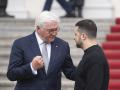 German President Frank-Walter Steinmeier (L) bids farewell to Ukraine's President Volodymyr Zelensky after his visit on May 14, 2023 at the presidential Bellevue Palace in Berlin. (Photo by Christophe Gateau / POOL / AFP)