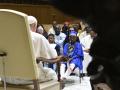 This handout photo taken and released by Vatican Media, the Vatican press office, on May 29, 2023, shows Pope Francis (L) attending a meeting with children from various African nations, on the occasion of "Day for Africa", at the Vatican. (Photo by VATICAN MEDIA / VATICAN MEDIA / AFP) / RESTRICTED TO EDITORIAL USE - MANDATORY CREDIT "AFP PHOTO /  VATICAN MEDIA " - NO MARKETING NO ADVERTISING CAMPAIGNS - DISTRIBUTED AS A SERVICE TO CLIENTS