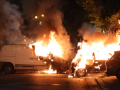 Two vehicles burn on the fifth night of protests in Paris