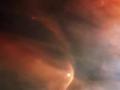 Imagen infrarroja de la onda de choque creada por la enorme estrella gigante Zeta Ophiuchi en una nube de polvo interestelar