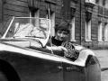 Francoise Sagan conduce su Jaguar, 1954 (b/w photo)