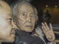 (FILES) Former Peru's President (1990-2000) Alberto Fujimori sits between his children Kenji (L) and Keiko upon his release from the Barbadillo prison in the eastern outskirts of Lima, on December 6, 2023. Former Peruvian president Alberto Fujimori, 85, is hospitalized in intensive care after suffering a hip fracture in a domestic accident, his family announced on June 26, 2024. (Photo by Renato PAJUELO / AFP)