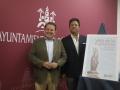 Julián Urbano y Marcos Santiago, junto al cartel de la Velada de la Fuensanta