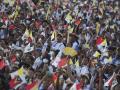 Catholic faithful react during holy mass led by Pope Francis at the Esplanade of Tasitolu in Dili, East Timor, on September 10, 2024. (Photo by Dita ALANGKARA / POOL / AFP)