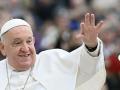 Pope Francis waves to the crowd during the weekly general audience at St Peter's Square in The Vatican on November 20, 2024. (Photo by Filippo MONTEFORTE / AFP)