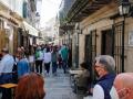 Varias personas en una calle de terrazas de Baiona, en Vigo