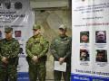 Colombian soldiers stand next to a banner with the most wanted members of the National Liberation Army (ELN) guerrilla group during a press conference by the Colombian Defense Minister Ivan Velazquez after his visit to the Catatumbo region in Cucuta, Norte de Santander Department, Colombia on January 24, 2025. The Colombian government launched a military offensive against ELN guerrillas on the border with Venezuela, who for the past week have been waging a bloody attack that has left more than 80 dead and 38,600 displaced. (Photo by Schneyder Mendoza / AFP)