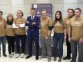 Varios miembros de la asociación de damnificados junto al abogado que les representa
