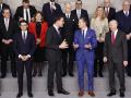 US Defense Secretary Pete Hegseth (C-R) speaks with NATO Secretary General Mark Rutte (C-L) during a group picture following a meeting of The North Atlantic Treaty Organisation (NATO) Ministers of Defence at NATO Headquarters in Brussels, on February 13, 2025. (Photo by SIMON WOHLFAHRT / AFP)