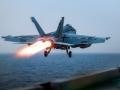 This handout photo released by the US Defence Visual Information Distribution Service (DVIDS) shows a US F/A-18 Super Hornet attack fighter jet taking off from the US Navy's Nimitz-class USS Harry S. Truman aircraft carrier at sea on March 16, 2025. Strikes hit Yemen's Huthi-held capital Sanaa on March 15, the rebels' Al-Masirah TV said, after US President Donald Trump announced military action. "An American-British aggression raided a residential neighbourhood in the Shuub district, north of the capital, Sanaa," Al-Masirah said. There was no immediate comment from British authorities. (Photo by Darren CORDOVIZ / DVIDS / AFP)