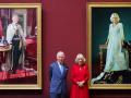 Britain's King Charles III and Britain's Queen Camilla pose with their official Coronation State Portraits, with the King's painted by artist Peter Kuhfeld, and the Queen's by artist Paul S. Benney, during a visit to The National Gallery, in central London, on May 6, 2025. (Photo by Chris Jackson / POOL / AFP) / RESTRICTED TO EDITORIAL USE - MANDATORY MENTION OF THE ARTIST UPON PUBLICATION - TO ILLUSTRATE THE EVENT AS SPECIFIED IN THE CAPTION