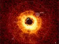 Imagen del disco alrededor de la estrella TWA 7 registrada con el instrumento SPHERE del Very Large Telescope de la ESO. La imagen capturada con el instrumento MIRI del JWST se superpone. Podemos ver claramente el área vacía alrededor de TWA 7 B en el anillo R2 (CC #1)