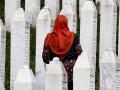 SREBRENICA (Bosnia and Herzegovina), 09/07/2025.- (FILE) - A Bosnian Muslim woman visits gravestones during a funeral ceremony for thirty newly-identified Bosnian Muslim victims, at the Potocari Memorial Center and Cemetery, in Srebrenica, Bosnia and Herzegovina, 11 July 2023 (reissued 09 July 2025). The UN General Assembly designated 11 July as the International Day of Reflection and Commemoration for the 1995 Genocide in Srebrenica perpetrated by the Bosnian Serb army. The massacre led to the killing of at least 8,372 men and boys, the displacement of thousands, and the destruction of entire communities in Srebrenica, which had been designated a safe area by the UN Security Council. (Bosnia-Herzegovina) EFE/EPA/FEHIM DEMIR