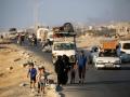 Habitantes de la ciudad de Gaza huyen hacia el sur antes del inicio de la ofensiva israelí