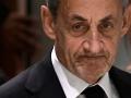 Former French president Nicolas Sarkozy leaves after the verdict in his trial for illegal campaign financing from Libya for his successful 2007 presidential bid, at the Tribunal de Paris courthouse in Paris, on September 25, 2025. A Paris court on September 25, 2025 sentenced former French president Nicolas Sarkozy to five years and ordered him to go to prison after finding him guilty of criminal conspiracy over accusations the late Libyan dictator Moamer Kadhafi helped fund his victorious 2007 presidential run. The court ordered that Sarkozy should be placed in custody at a later date, with prosecutors given one month to inform the former head of state when he should go to prison. (Photo by JULIEN DE ROSA / AFP)
