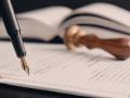 Agreement concept with fountain pen and documents. Notary public, attorney, law close up composition