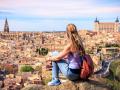 Woman travelling in Europa- Panoramic view of Toledo city in Spain
