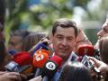 Moreno, a su llegada a la sede del PP en Madrid