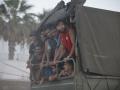 Un camión militar transporta personas, a 2 de agosto de 2026, en Ceuta (España)