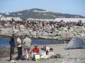 Varios inmigrantes en una playa, a 21 de agosto, en Ceuta