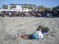 Varios inmigrantes en una playa, a 21 de agosto de 2026, en Ceuta (España).