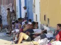 Inmigrantes y menores en las naves del Tarajal a la espera de ser realojados