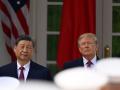 US President Donald Trump (R) and Chinese President Xi Jinping