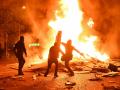 This photograph shows a fire burning and destroying the city hall after a group of individuals forced entry into the building during ongoing protest action against the "high cost of living", in Limoges, central France on October 17, 2026 as part of a nationwide call for mobilisation bringing together various groups expressing their anger: former "Yellow Vest", secondary school and university students, climate activists and even farmers. After weeks of student protests, France faces broader, nationwide demonstrations on October 17, 2026 over the cost of living, setting up a potentially fraught six months heading into a presidential election. A police source told AFP that authorities estimated nearly 200,000 people could take part, with 40,000 in Paris. (Photo by Melaine PAYZAL / AFP)