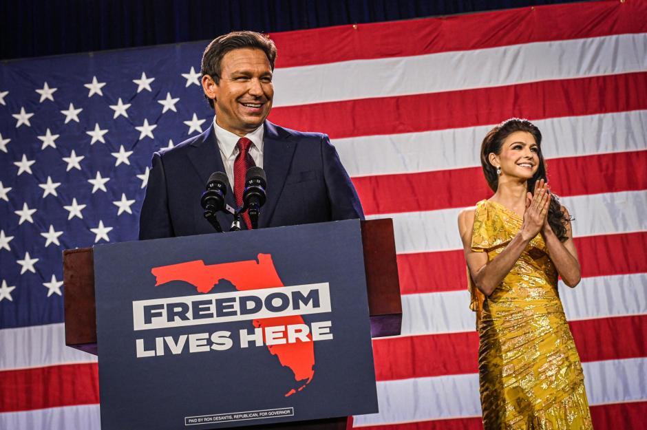 Republican gubernatorial candidate for Florida Ron DeSantis with his wife Casey DeSantis speaks to supporters during an election night watch party at the Convention Center in Tampa, Florida, on November 8, 2022. - Florida Governor Ron DeSantis, who has been tipped as a possible 2024 presidential candidate, was projected as one of the early winners of the night in Tuesday's midterm election. (Photo by Giorgio VIERA / AFP)