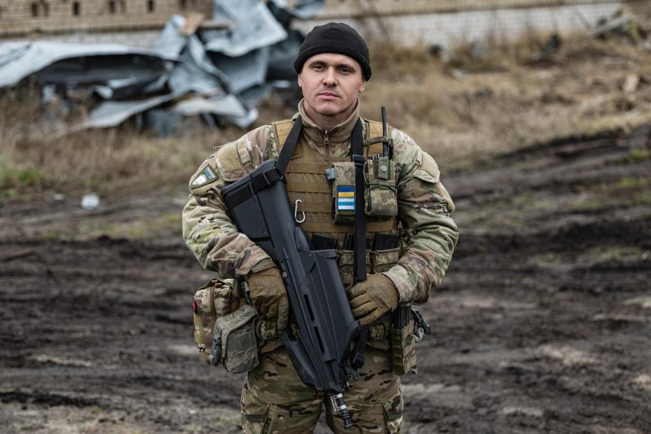 Tikhiy, 41-year-old, a Russian who joined the Freedom of Russia Legion to fight on the side of Ukraine, poses for a photograph in Dolyna, eastern Ukraine on December 26, 2022. - Freedom of Russia Legion is a Foreign volunteer legion formed in March 2022 with defectors from the Russian Armed Forces, Russian and Belarusian volunteers. (Photo by Sameer Al-DOUMY / AFP)