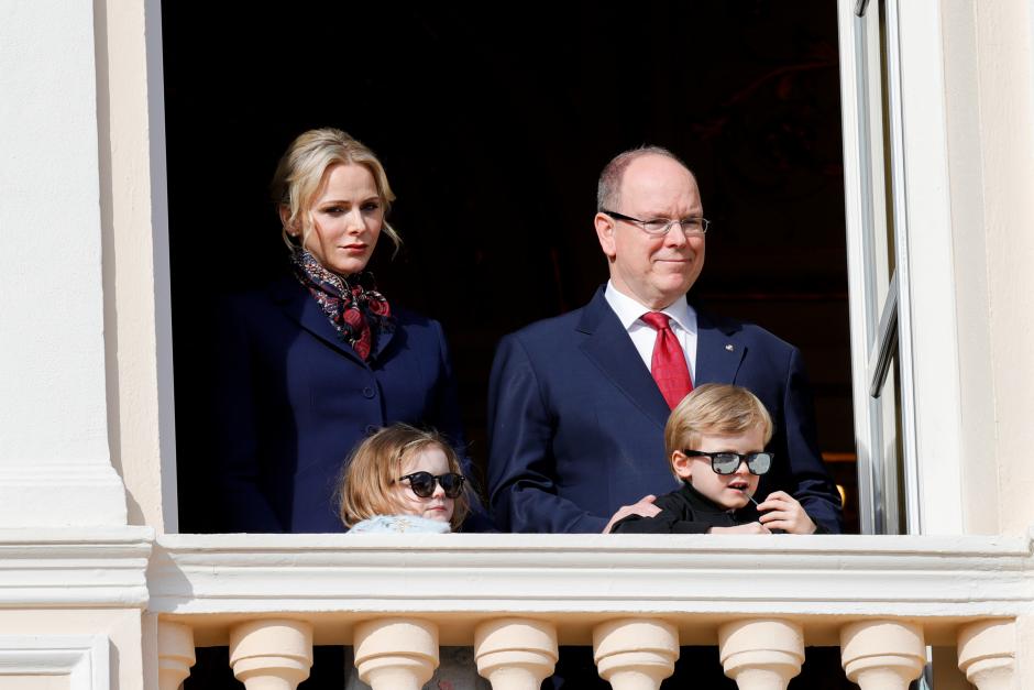 Prince Albert II of Monaco, his wife Princess Charlene and their children Prince Jacques and Princess Gabriella stand on the palace balcony during the traditional Sainte Devote procession in Monaco, January 27, 2020.