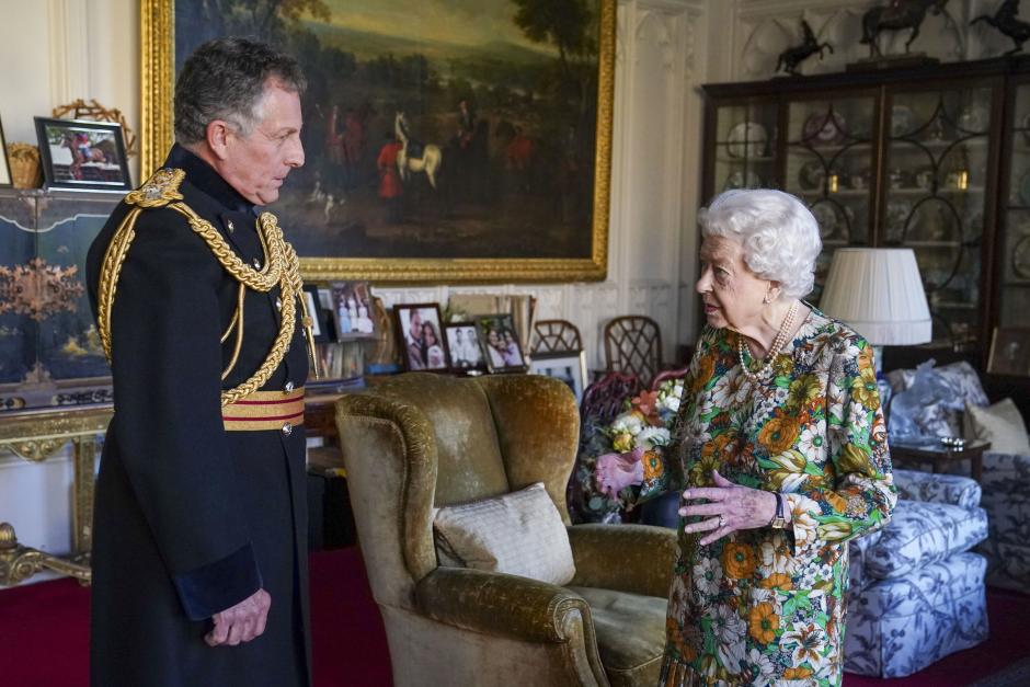 Queen Elizabeth II receives General Sir Nick Carter, Chief of the Defense Staff, left, during an audience in the Oak Room at Windsor Castle, Berkshire, Wednesday Nov. 17, 2021.