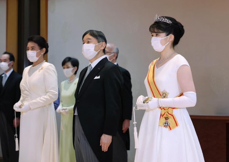 Princess Aiko (R), the daughter of Emperor Naruhito (C) and Empress Masako (L) is celebrated by the three branches of government-legislative, administrative and judicial, political leaders during her coming-of- age ceremony at the Imperial Palace in Tokyo on Dec. 5, 2021.   *** Local Caption *** .