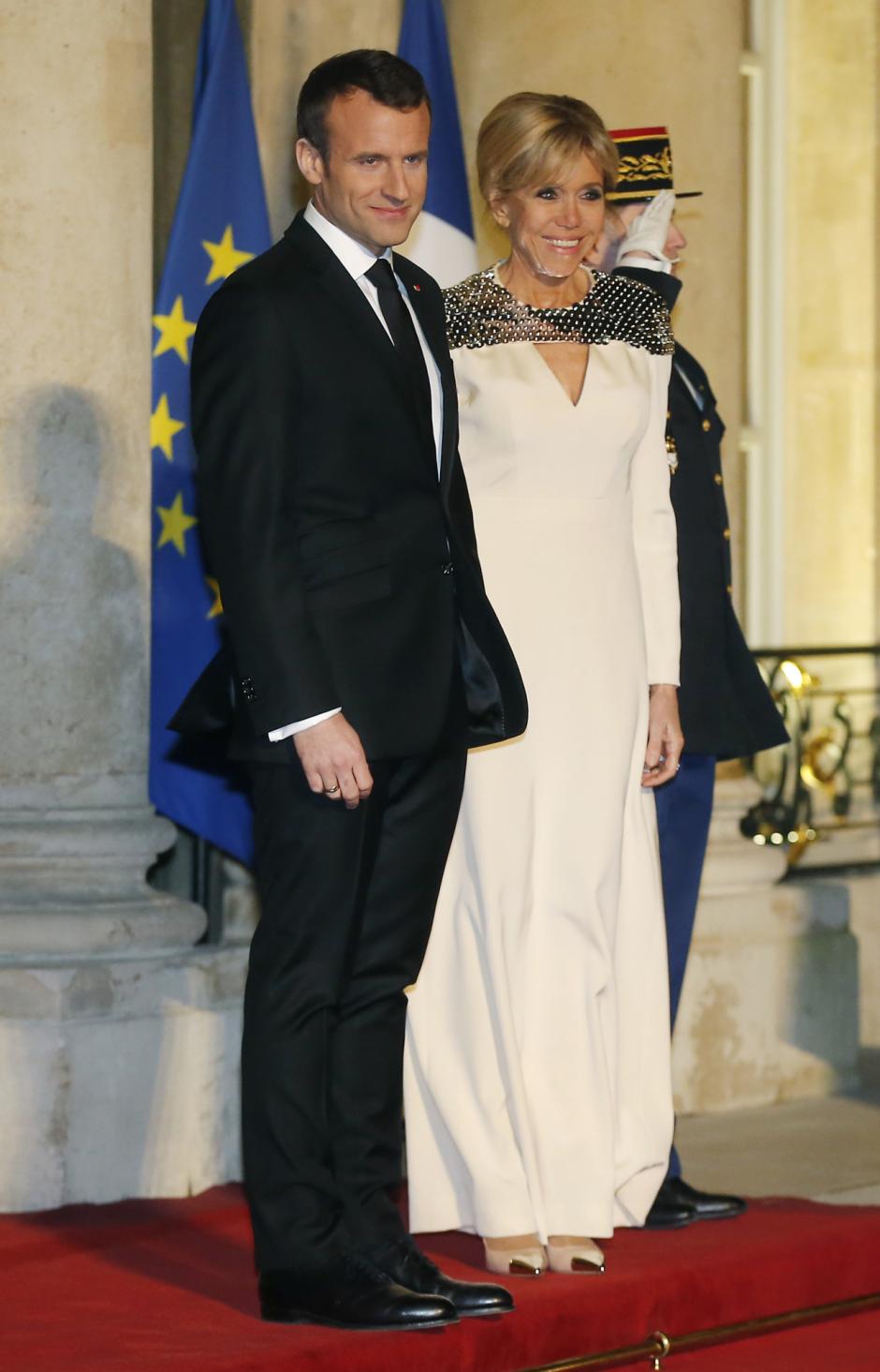 France's President Emmanuel Macron and his wife Brigitte to a State dinner at the ElyseePalace in Paris, Monday, March 19, 2018.
