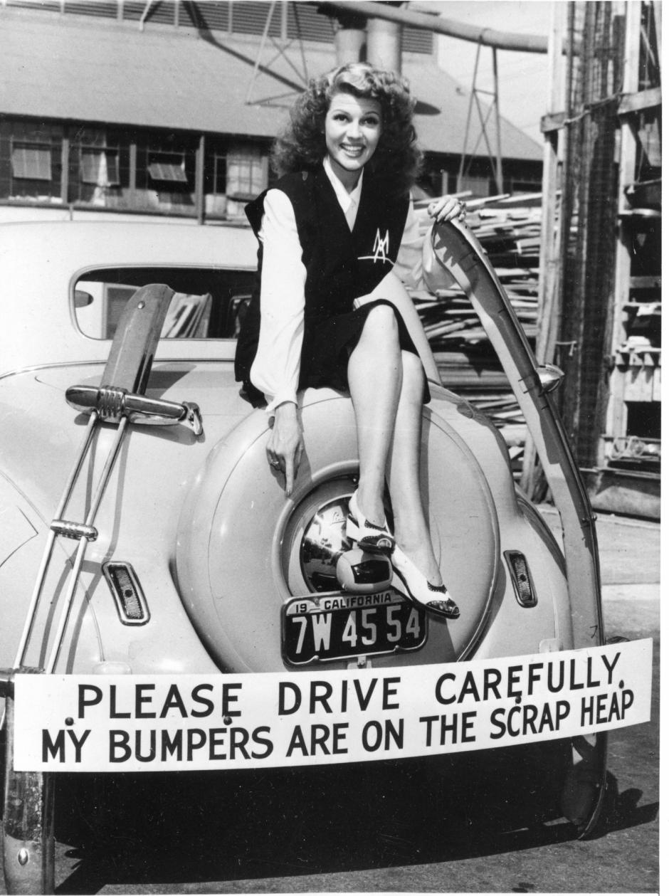 Actress Rita Hayworth participates in the scrap metal recycling campaign by donating her car's bumper in response to the call for bumpers and other non-essential metal car parts for the war effort in Hollywood, Ca., Oct. 4, 1942.  Hayworth has also been selling war bonds.  (AP Photo)