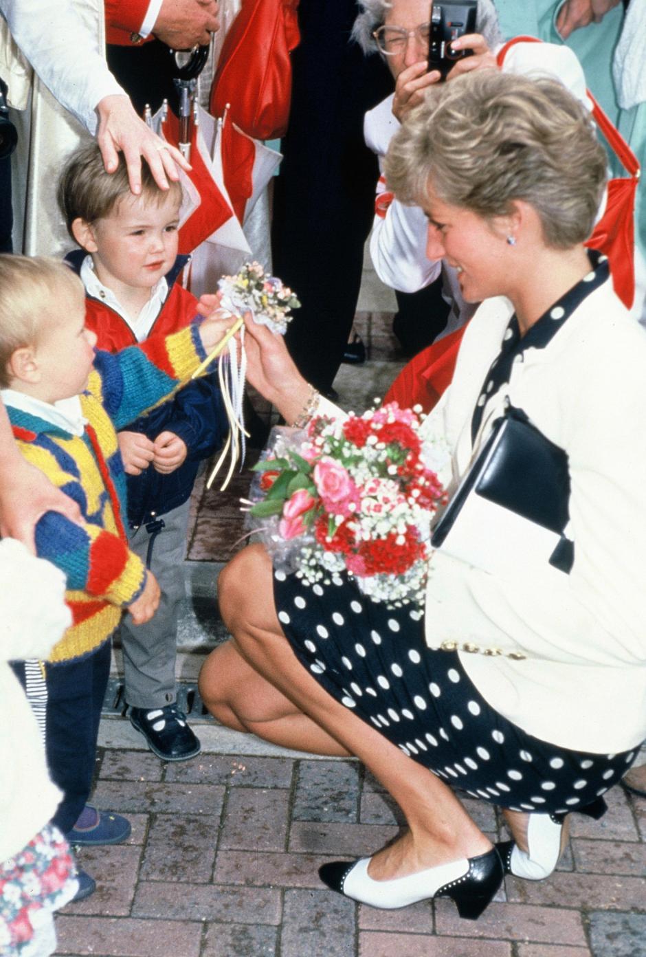 Princess Diana chats with little children as she arrives for a media awards lunch in Westminster, London June 1992. London, Great Britain.