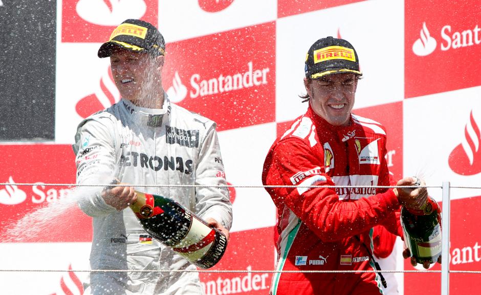 Michael Schumacher y Fernando Alonso en los más alto del podio