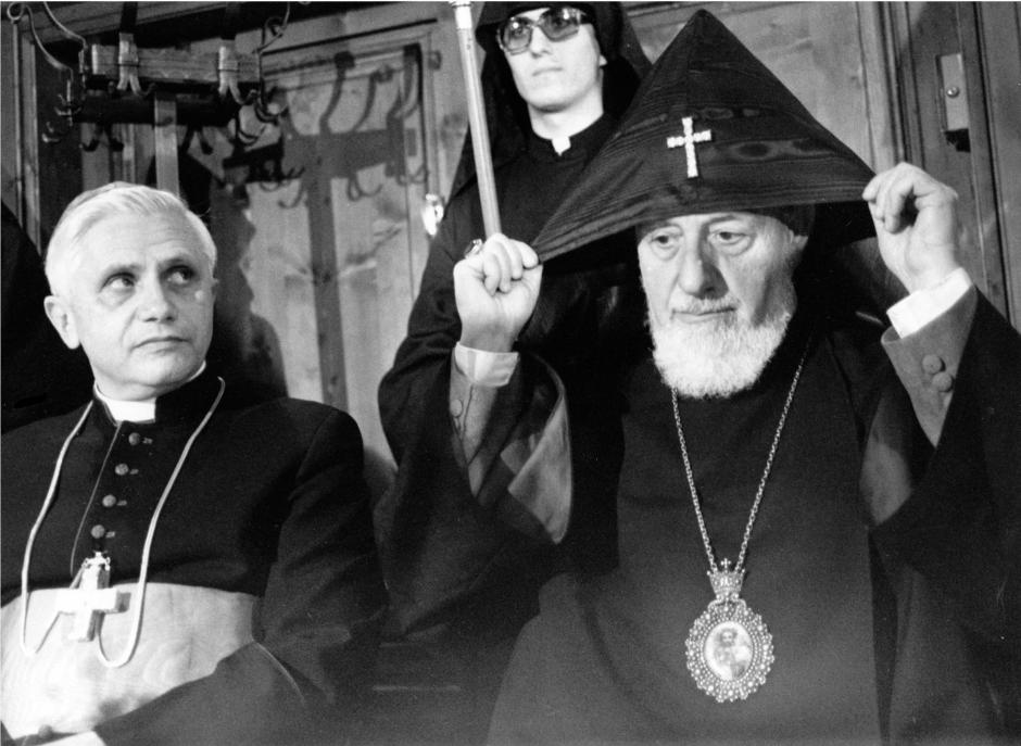 German Cardinal Joseph Ratzinger, left, head of the Vatican s watchdog body on doctrine, looks on while the head of the Armenian-Orthodox Church, Vasken I Baldyan, adjusts the hood of his habit in Munich, 1981.